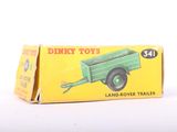 a box with a green toy truck inside of it