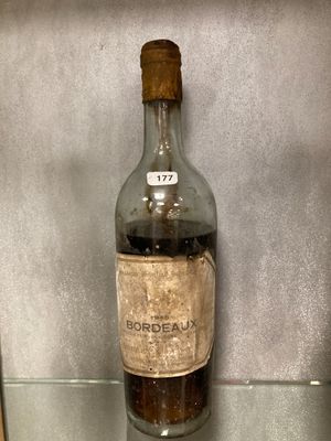 a bottle of liquor on display in a glass case