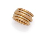 a gold ring with three bands on a white background