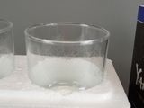 two glasses that are sitting on top of a towel