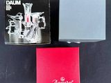 the box of the perfume is next to the box of the perfume