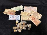 several different types of money are scattered on a black surface