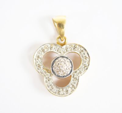 a gold and diamond flower pendant on a white background