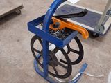 a blue cart with tools on it in a warehouse