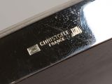 a close up of a silver plate with a logo on it