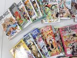 a lot of comic books on the table together