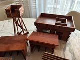 a small table with four wooden chairs and a small table with a small table top