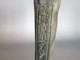 statue of an ancient egyptian statue of a man with a tusk on his head