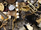 many different types of jewelry that are in a pile