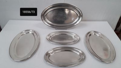 six silver trays and a bowl on a table with a price tag