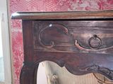 a wooden table with a drawer on top of it