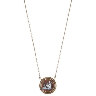 a necklace with a picture of a man and woman on it