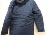an image of a blue jacket hanging on a wall