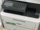 a white printer sitting on top of a white cabinet