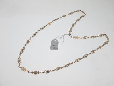 a close up of a necklace with a tag attached to it