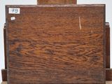 a wooden easel with a piece of wood on top of it