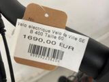 a close up of a bicycle handlebar with a price tag