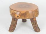 an image of a small wooden stool on a white background