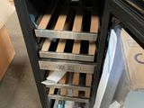 an image of a small refrigerator with a lot of boxes