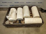four rolls of toilet paper in a wooden box