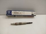 a close up of a pen on a table next to a box