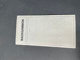 the back cover of a book with a black and white logo on it