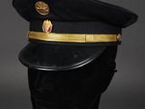 a close up of a black hat on a mannequin head