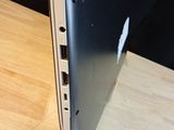 a close up of a laptop computer on a wooden table