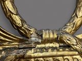 an image of a close up of a gold frame with a bird on it