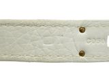 a close up of a white leather belt with a gold buckle