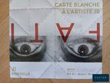 a poster with a picture of a man ' s eyes on it