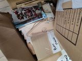 a cardboard box that has a bunch of items inside of it