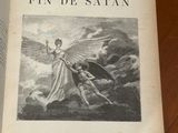 a book with a picture of an angel on it on a table