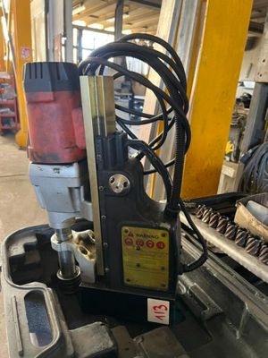 an image of a machine that is sitting in a garage