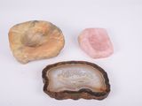 three different types of rock and stone on a white surface