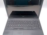 an open laptop computer sitting on top of a white table