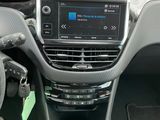 the interior of a car with a steering wheel and dashboard controls