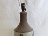 a lamp that is sitting on a white surface