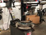 a machine that is sitting in a garage with boxes