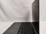 an open laptop computer sitting on top of a white table