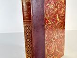 a close up of a book on a table with a white background