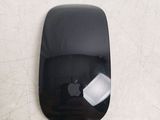 a black apple mouse with an apple logo on it