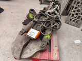 a pile of tools on a pallet in a warehouse