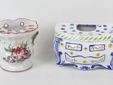 two vases sitting next to each other on a white surface