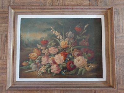 une photo d'un tableau représentant des fleurs, dans un cadre en bois