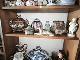 many different types of china on the shelves in this room