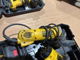 two electric tools in a box on a table
