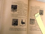 an open book with a yellow sticker on it