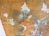 a picture of a rusted wall with some paint on it