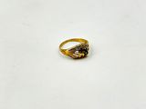 a gold ring with a black stone in the middle
